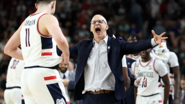Uconn’s head coach, Dan Hurley, celebrates with his team during the final seconds of the 2024 National Championship game. 